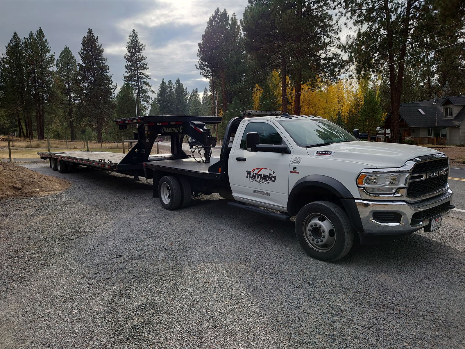 Tumalo Transport Ram 5500 tow rig with a gooseneck flatbed trailer